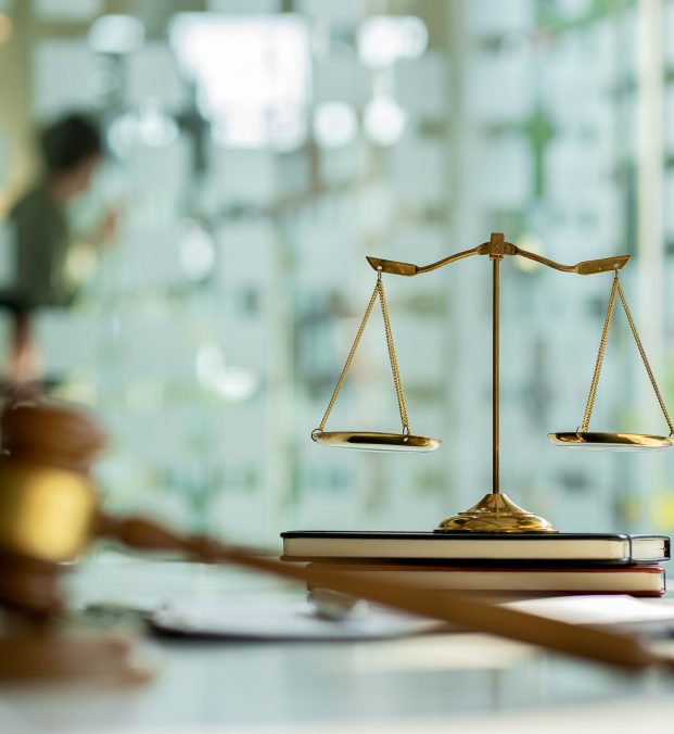 Consulting of businessmen and male lawyers or judges counselors whose teams meet with clients with hammers and goddess scales placed next to them. Legal Service Concepts
